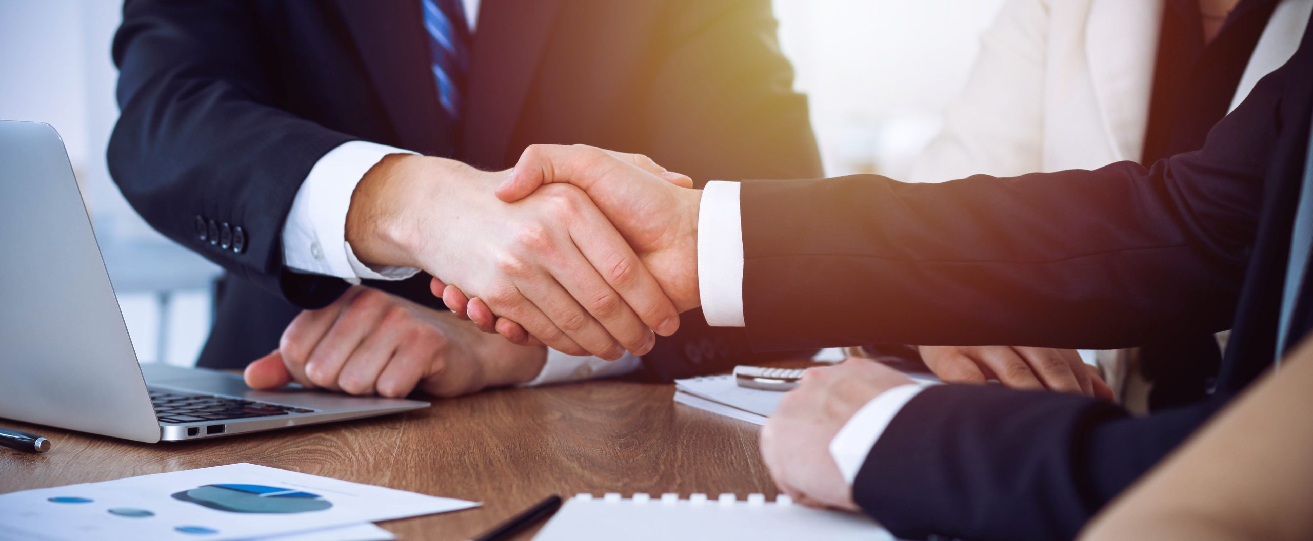 Business people shaking hands at meeting or negotiation in the office. Handshake concept. Partners are satisfied because signing contract.